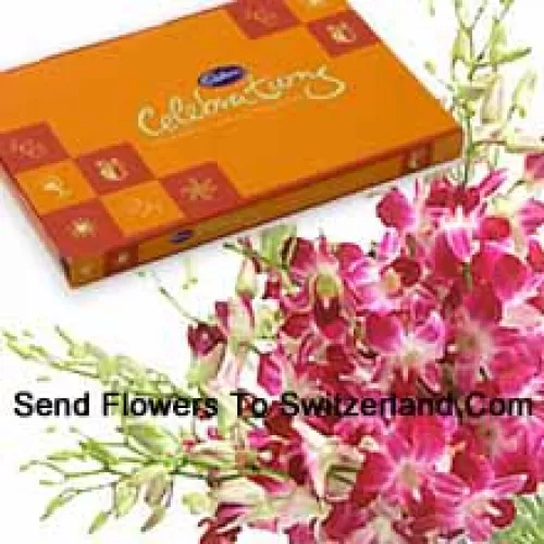 Прекрасный букет розовых орхидей вместе с красивой коробкой шоколадных конфет Cadbury